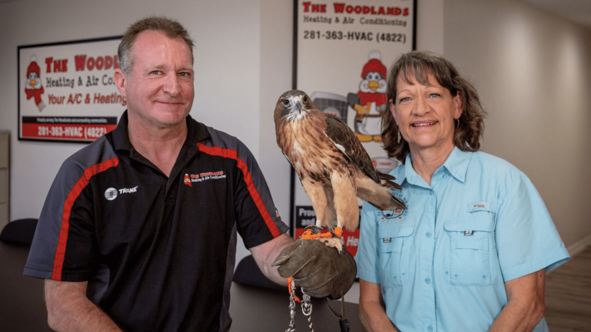 woodlands technicians holding an eagle