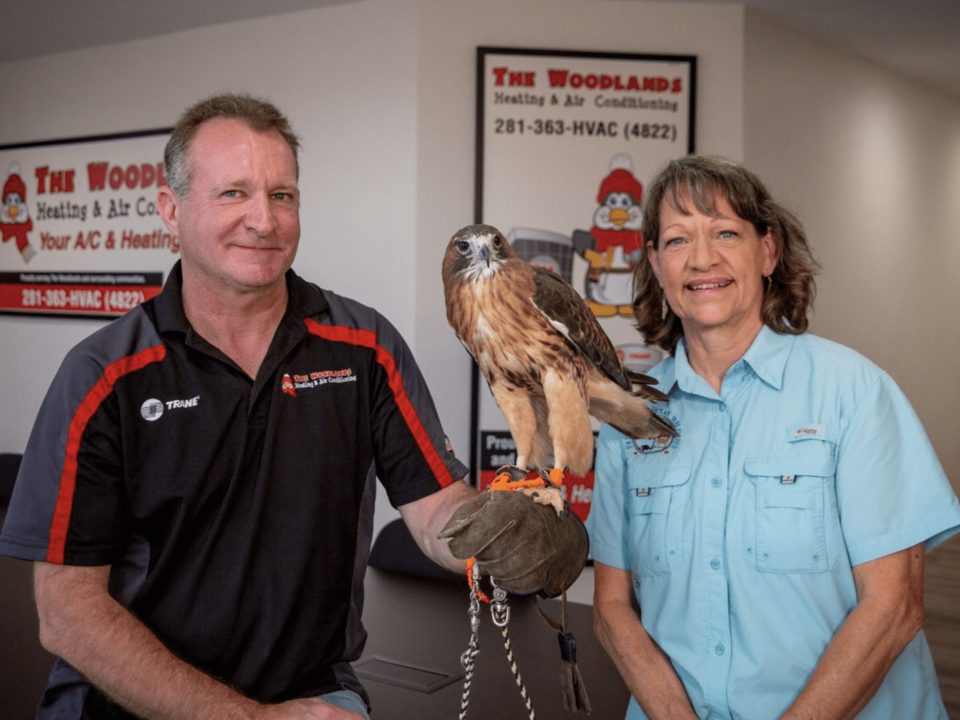 woodlands technicians holding an eagle