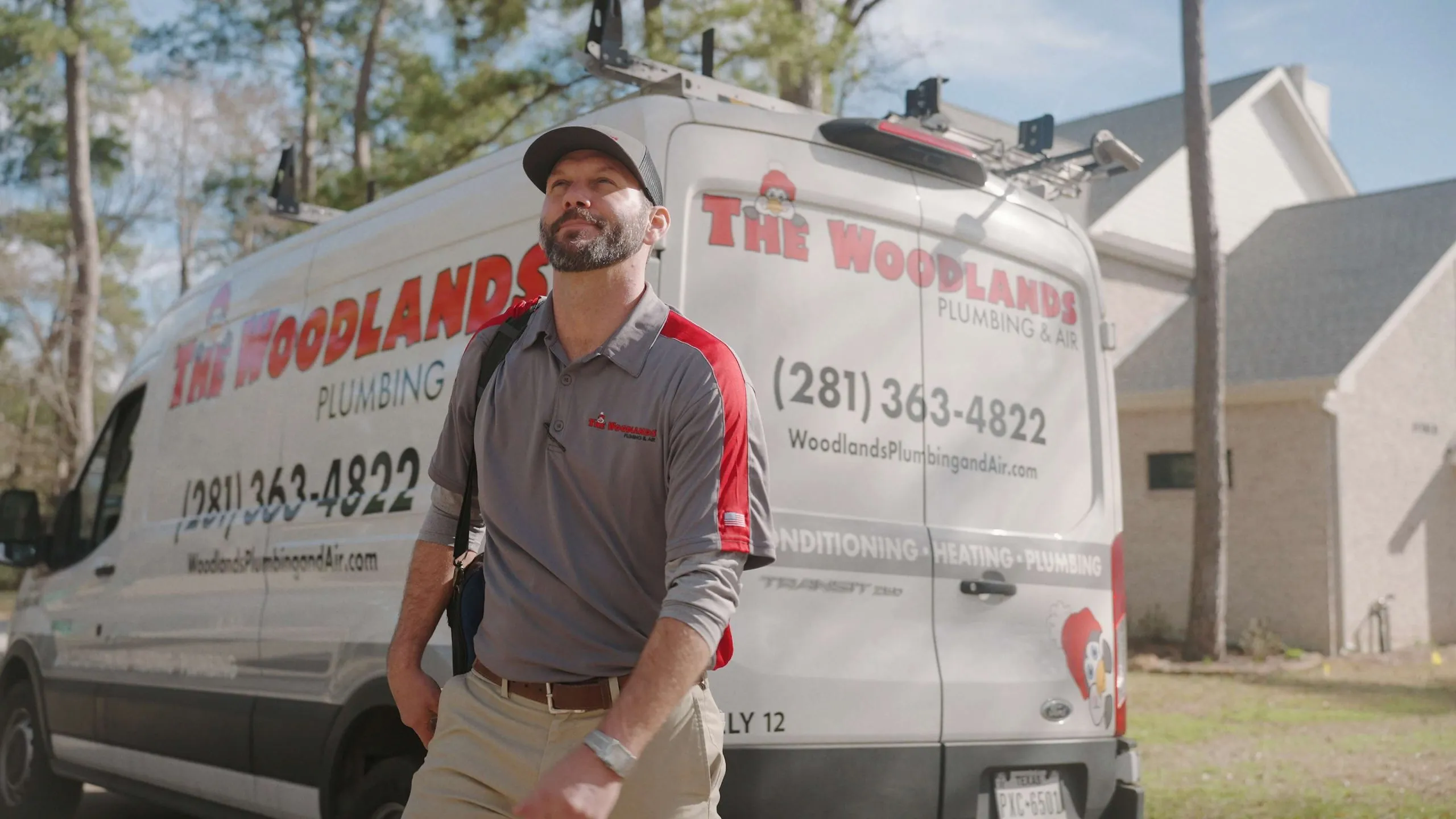technician walking into a house