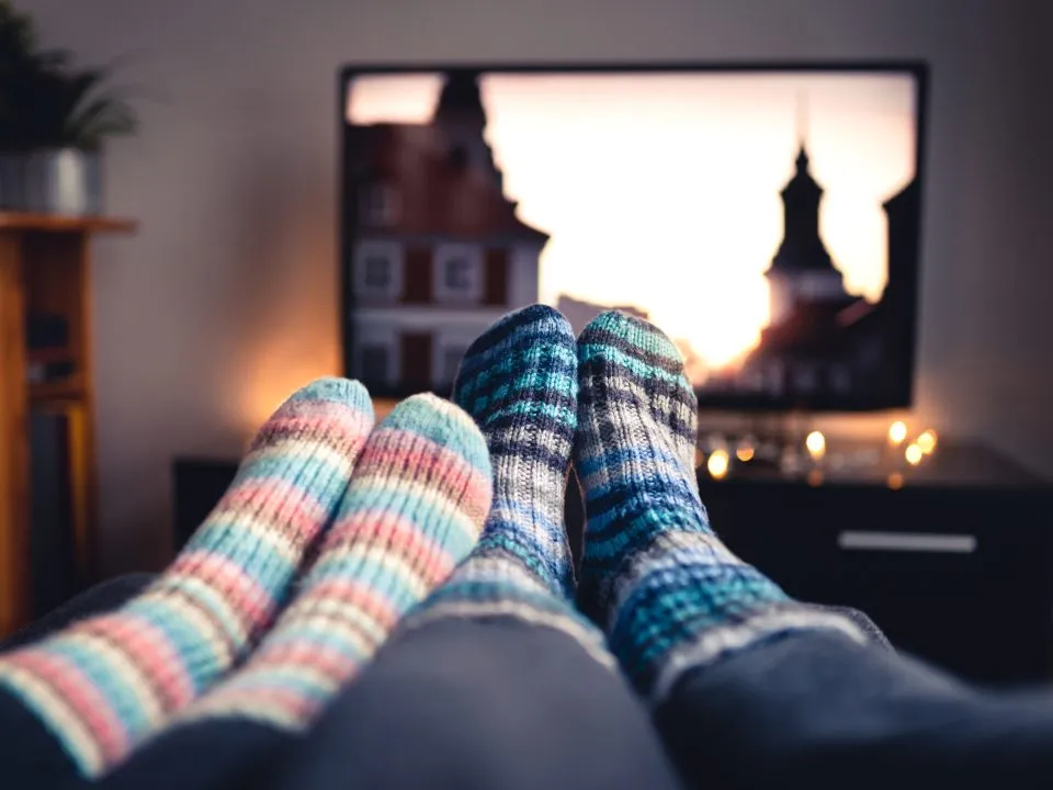 pair of feet covered in warm socks